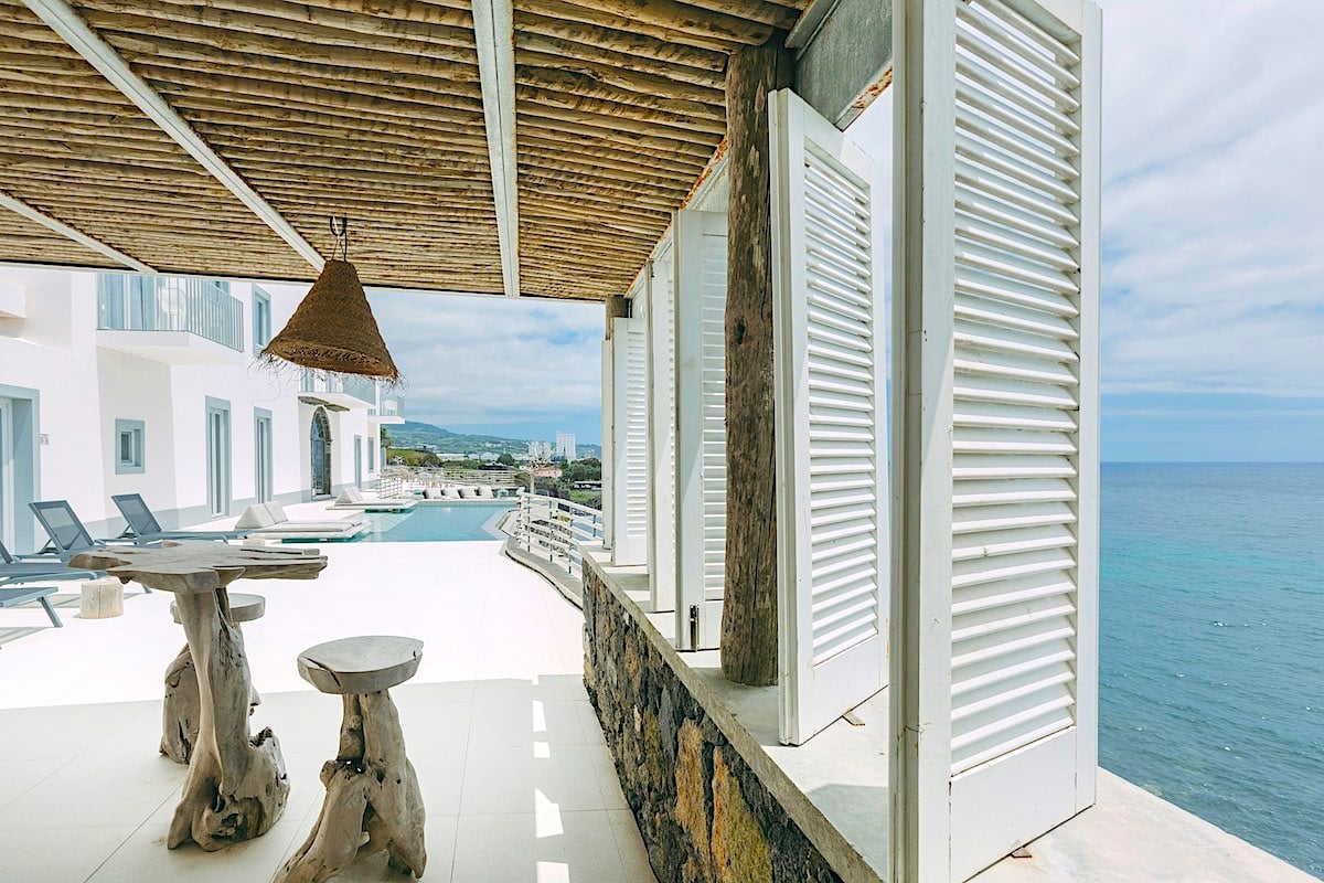 Terrace overlooking the ocean at White a luxury hotel in Azores. Credit: Manuel Dias).