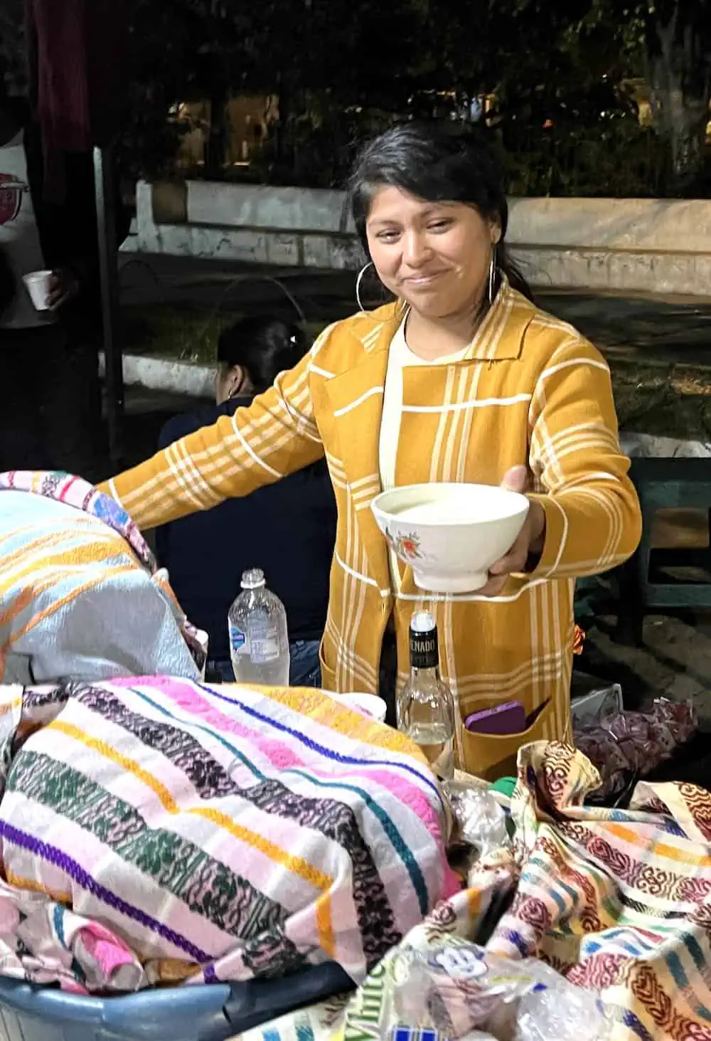 Street vendor in San Pedro Los Huertas serving atole blanco. (Credit: Francisco Sanchez)