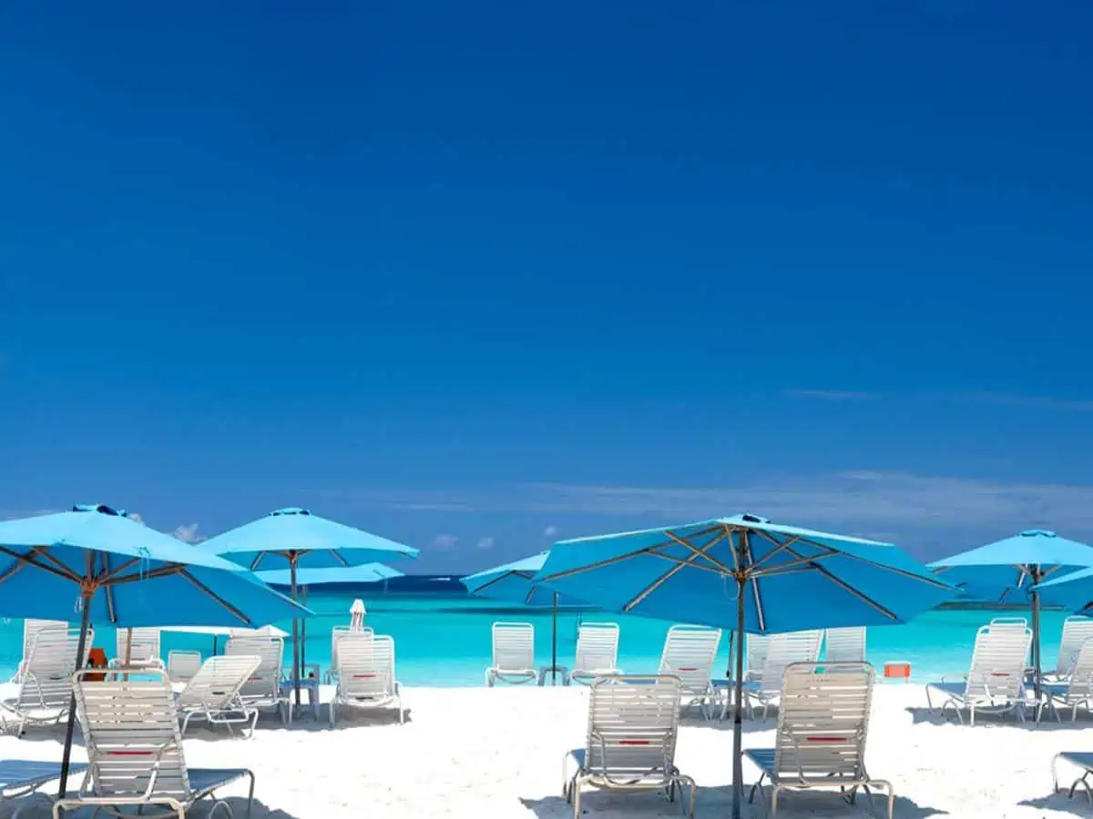 Mead's Bay Beach with beach chairs and umbrellas. 