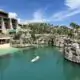 Woman paddleboarding at Hotel Xcaret Arte in Mexico.