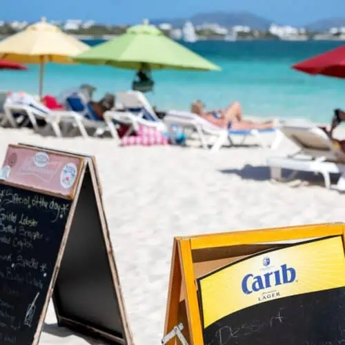 Beach bar signs on beach.